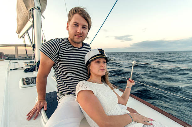 istock Happy young couple relaxing on a yacht 462999237