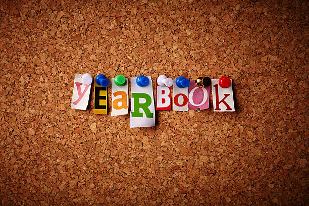 The word yearbook spelled out with magazine clippings stock photo
