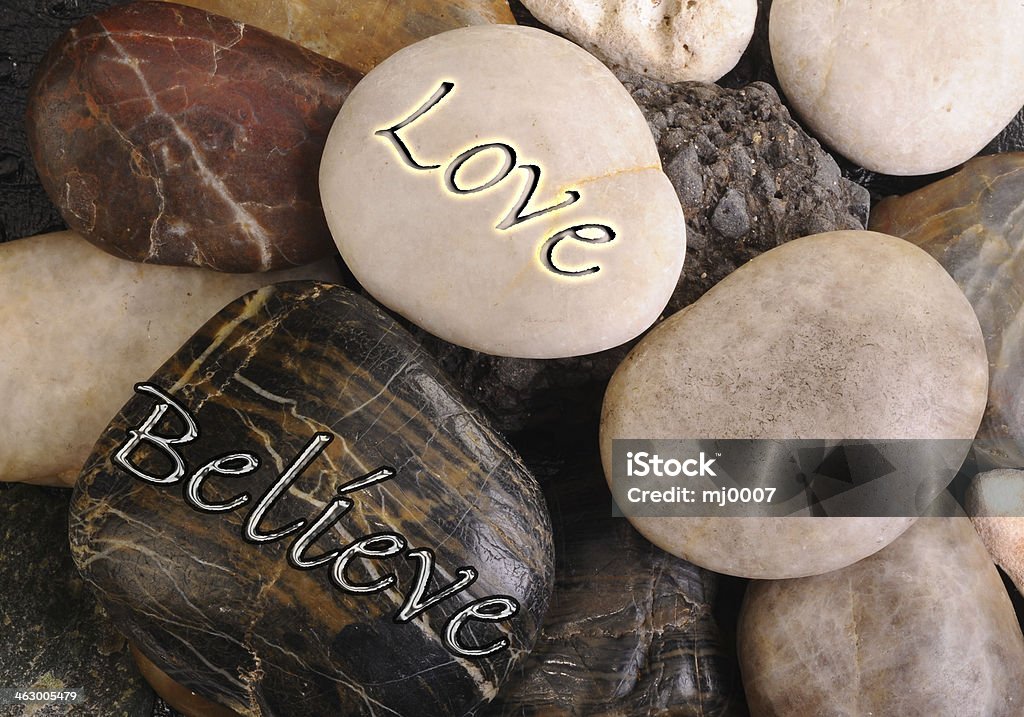 Love and Believe. Love and believe rocks. Alternative Therapy Stock Photo