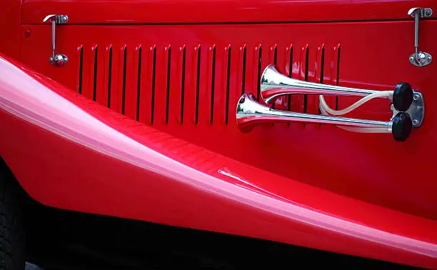 cropped image of a fully restored classic old car with lots of shiny chromecropped image of a fully restored classic old car with lots of shiny chrome