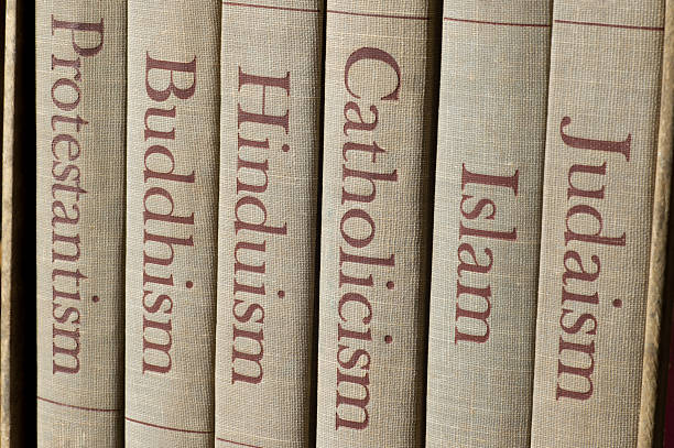 major world religions Book spines listing major world religions - Judaism, Islam, Catholicism, Hinduism, Buddhism and Protestantism. protestantism photos stock pictures, royalty-free photos & images