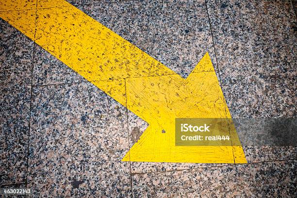 Directional Arrow Road Yellow Marking On Asphalt Stock Photo - Download Image Now - Arrow Symbol, Asphalt, Avenue