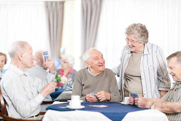 istock Group of senior people playing card 463026609