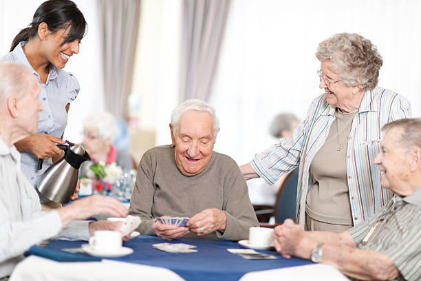 istock Group of senior people playing card 463026617