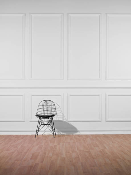 istock Black Chair Against White Wall 463032261