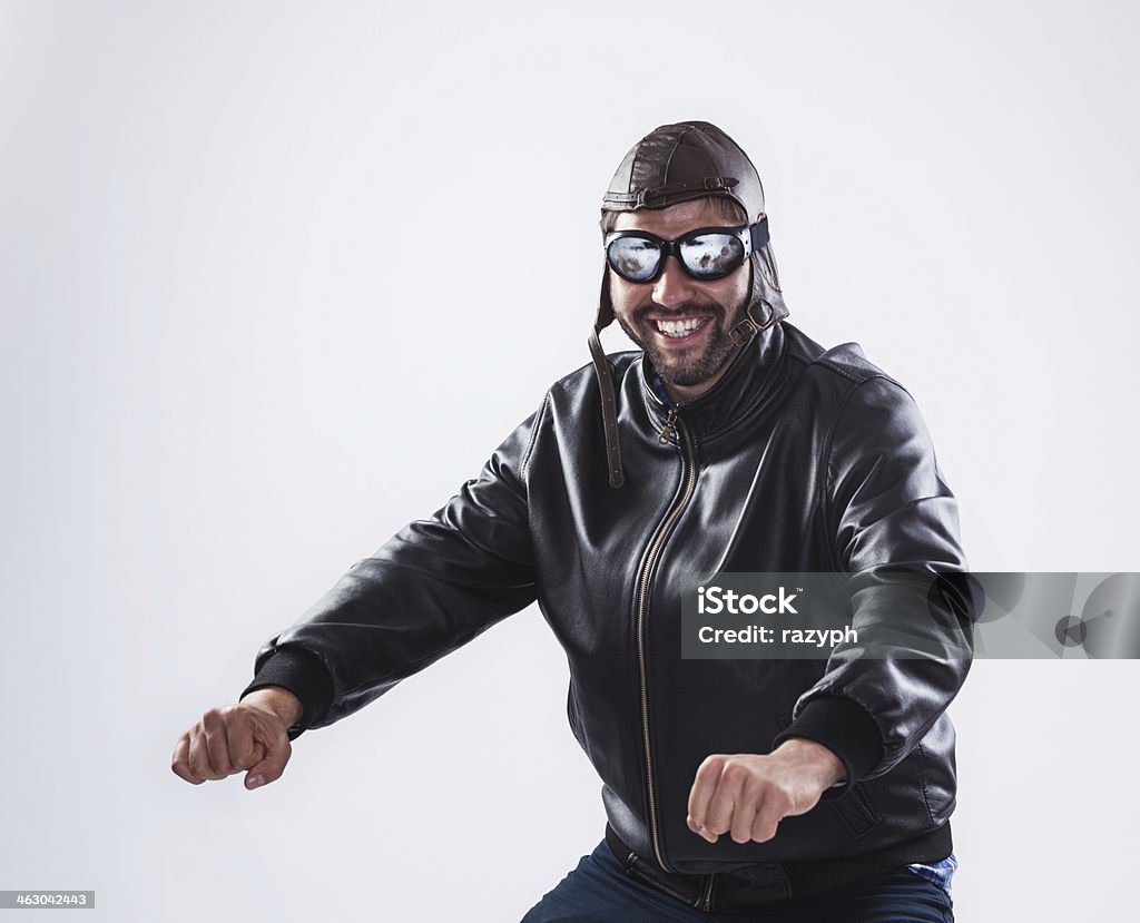 Smiling Man Posing As A Motorcyclist Stock Photo - Download Image Now -  Motorcycle, White Background, Bicycle - iStock