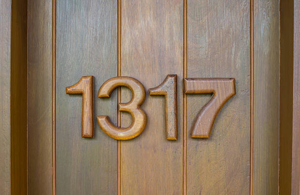 istock room numbers of doors with brown wooden 463043679