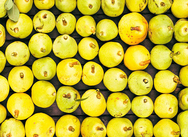 Freshly picked yellow pears at a famers market closeup,