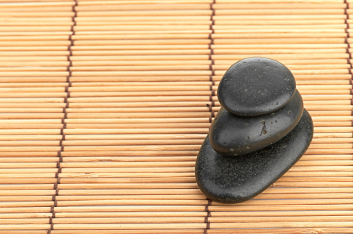 The spa a stone on bamboo background
