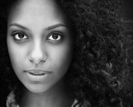 Black and white closeup portrait of a beautiful young woman