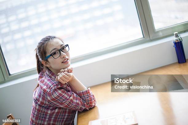 Young Woman In A Library Stock Photo - Download Image Now - 20-29 Years, Adult, Black Hair