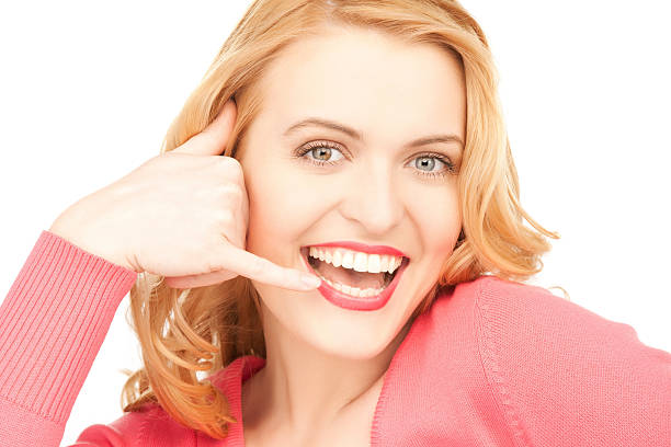 istock happy woman making a call me gesture 463060397
