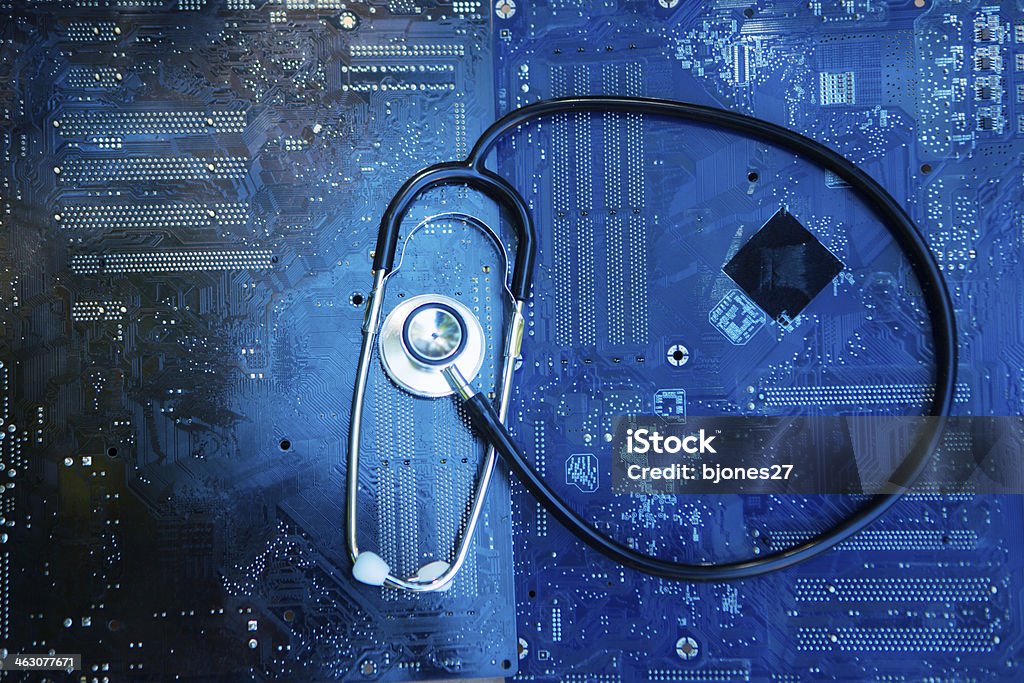 Health and Technology stethoscope and motherboard Healthcare And Medicine Stock Photo