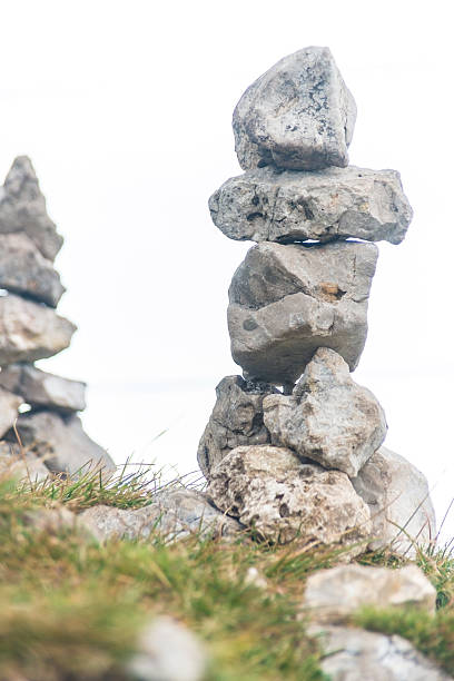 istock stack of stones small tower on meadow - kleiner Steinturm 463077987