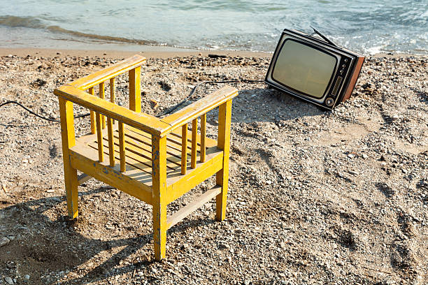 istock yellow chair and vintage television 463077995