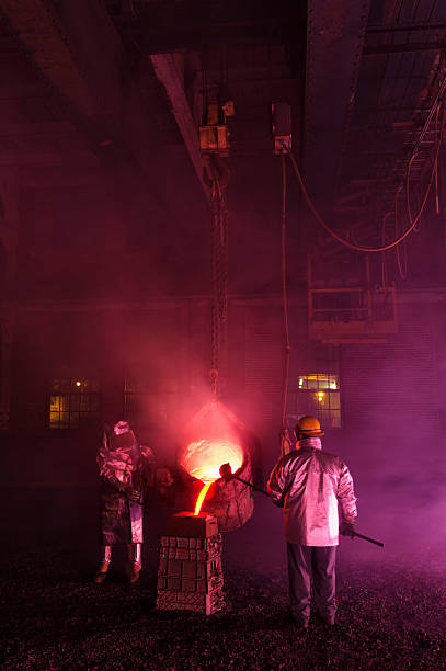 istock Hot Steel Mill Pour Reenactment, Metalurgical Workers with Ladle 463078259
