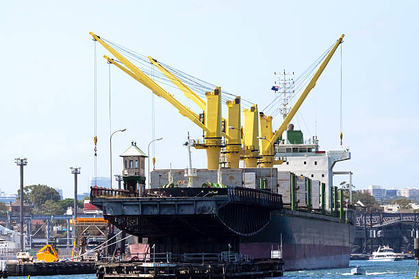istock Barge with cranes anchored at port 463078571