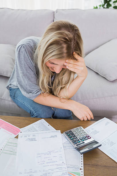istock Blonde stressing over her finances 463079071