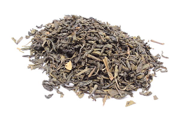 istock Heap of dried green tea on white background 463079143