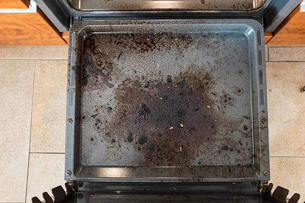 Dirty kitchen oven from above stock photo