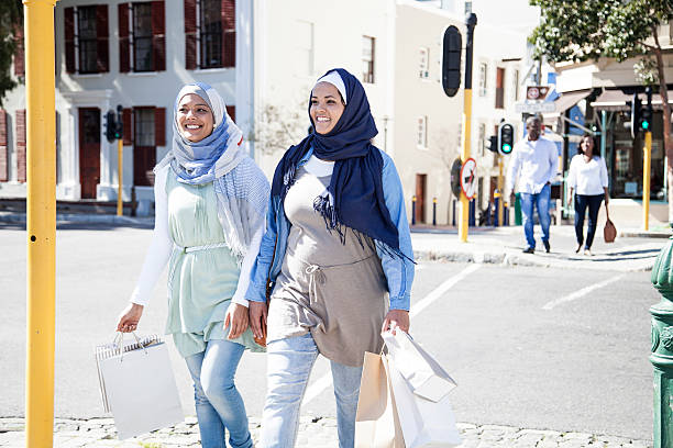 istock Two group of friends going for a walk after shopping 463080051