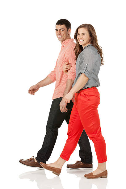 istock Smiling couple walking together 463080525