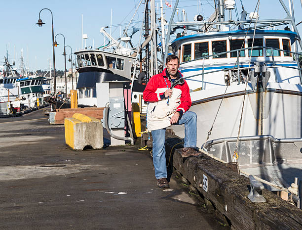 istock Commercial fisherman pauses on the dock 463080731