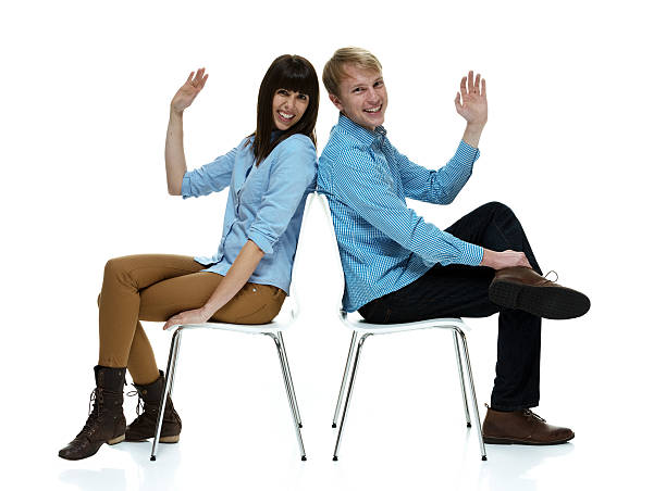 istock Smiling couple sitting on chair 463081735