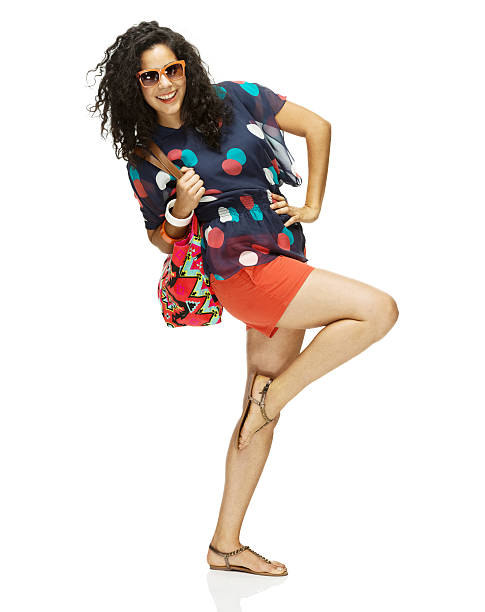 istock Smiling woman standing with hand on hip 463086499