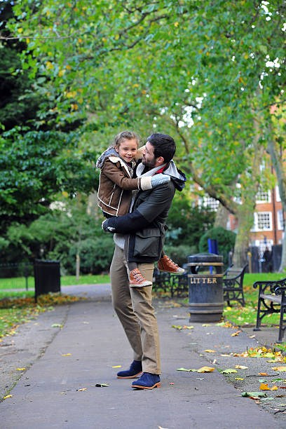 istock Father and Daughter Having Fun in Park, London, UK 463088279