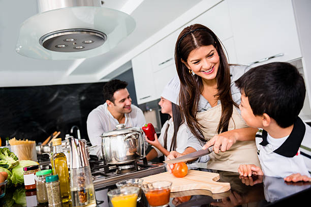 istock Family cooking dinner together 463091551