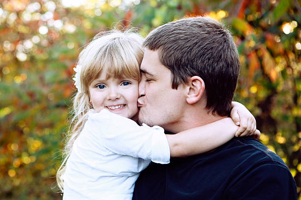 istock Dad Kissing Little Girl 463094321