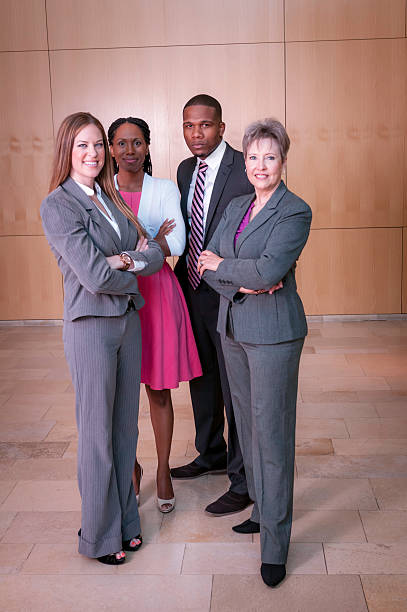 istock Group of diverse businesspeople standing with their senior executive (II) 463094847