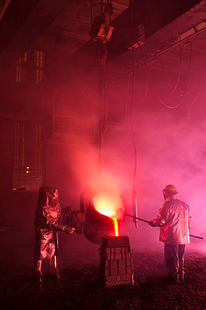 istock Hot Steel Mill Pour Reenactment, Metalurgical Workers with Ladle 463097321