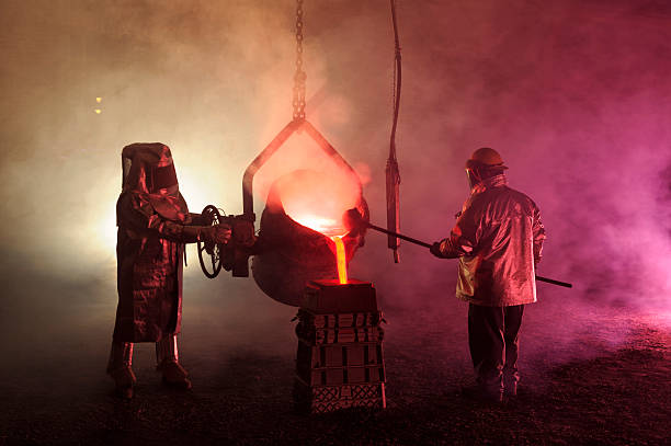 Hot Steel Mill Pour Reenactment, Metalurgical Workers with Ladle stock photo