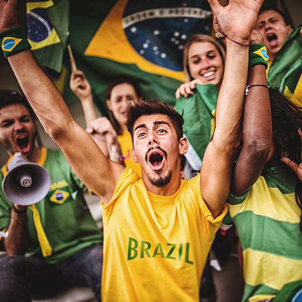 istock Group of brazilian supporters at stadium 463098011