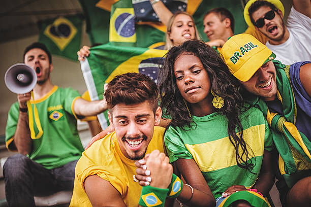 istock Group of brazilian supporters at stadium 463098039