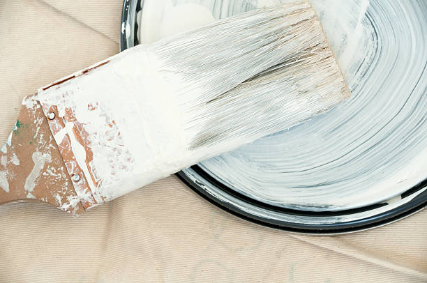istock Paint covered brush and lid on dropcloth. 463101213