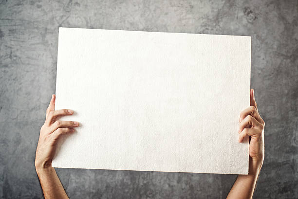istock Man holding white banner 463102153