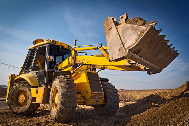 istock Earth mover working in a new road construction 463102239