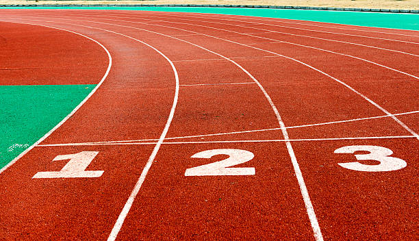 istock red plastic runway and numbers in a sports ground 463103483