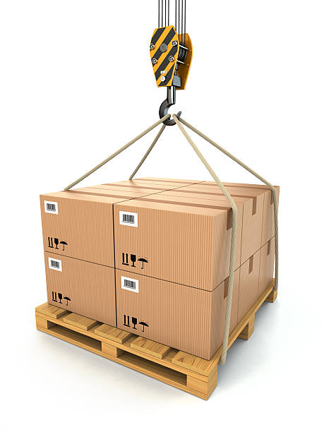 istock Cargo delivery. Pallet with cardboards lifted by crane. 463104045