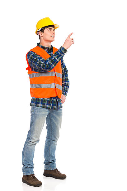 ingegnere reprimands. - manual worker full length isolated on white standing foto e immagini stock