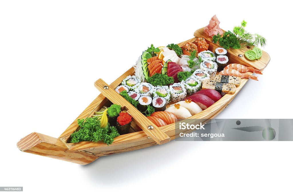 Collection of species sushi on the decorative plate ship. Collection of species sushi on the decorative plate ship. On a white background. Sushi Stock Photo