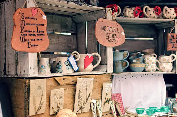 A rustic market stall in England offer handmade crafts and pottery.