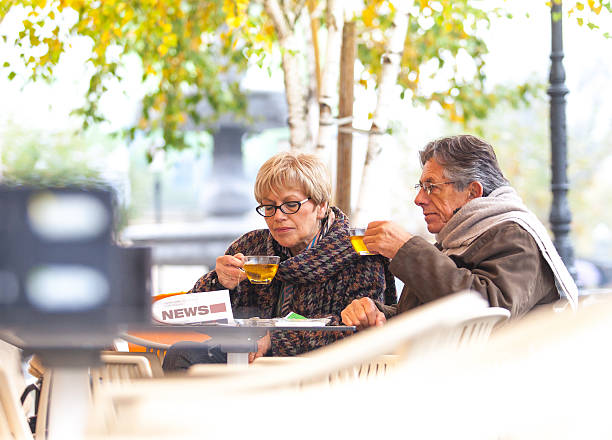 istock Senior couple drinking tea at the bar 463116743