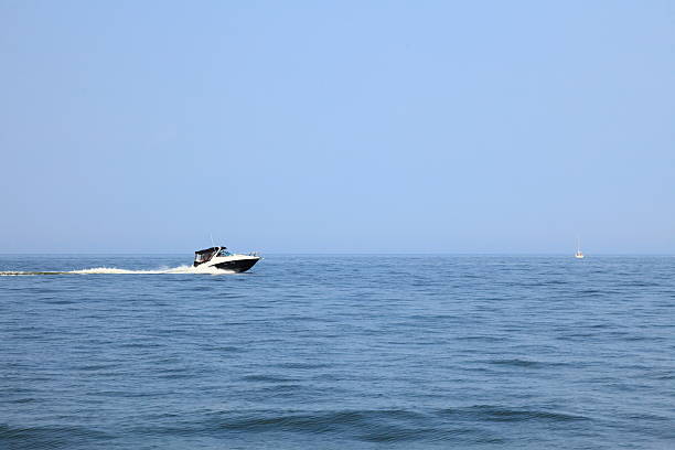 istock fast boat in blue sea view 463122567