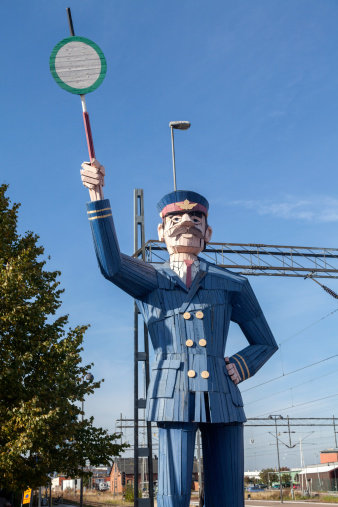 Wooden statue of a train station inspector, at central station in Linkoping, Sweden. Such wooden sculptures were made by woodcraft teacher students around Linkoping's 700th anniversary in 1987.