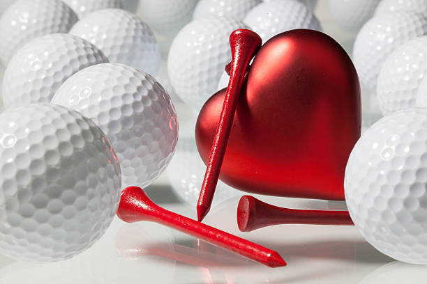 istock Many golf balls and red heart 463128837