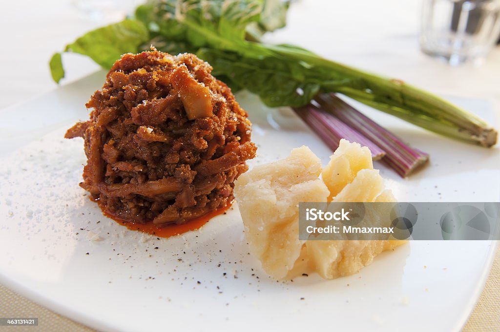 Tripe with shaved parmesan cheese Fypical Italian and Florentine recipe made ​​with offal of bovine Beef Stock Photo